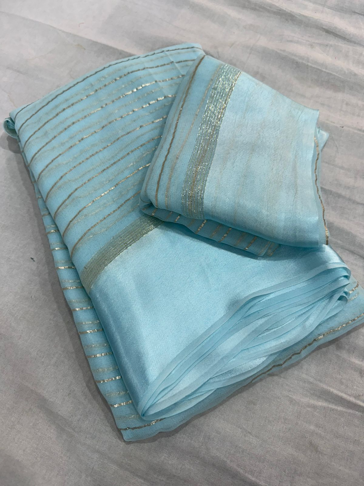 Elegant Sky  Viscose Georgette Saree with Satin Patti Border & Running Blouse