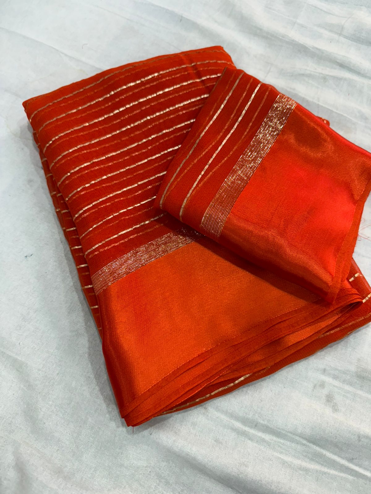 Elegant Orange  Viscose Georgette Saree with Satin Patti Border & Running Blouse